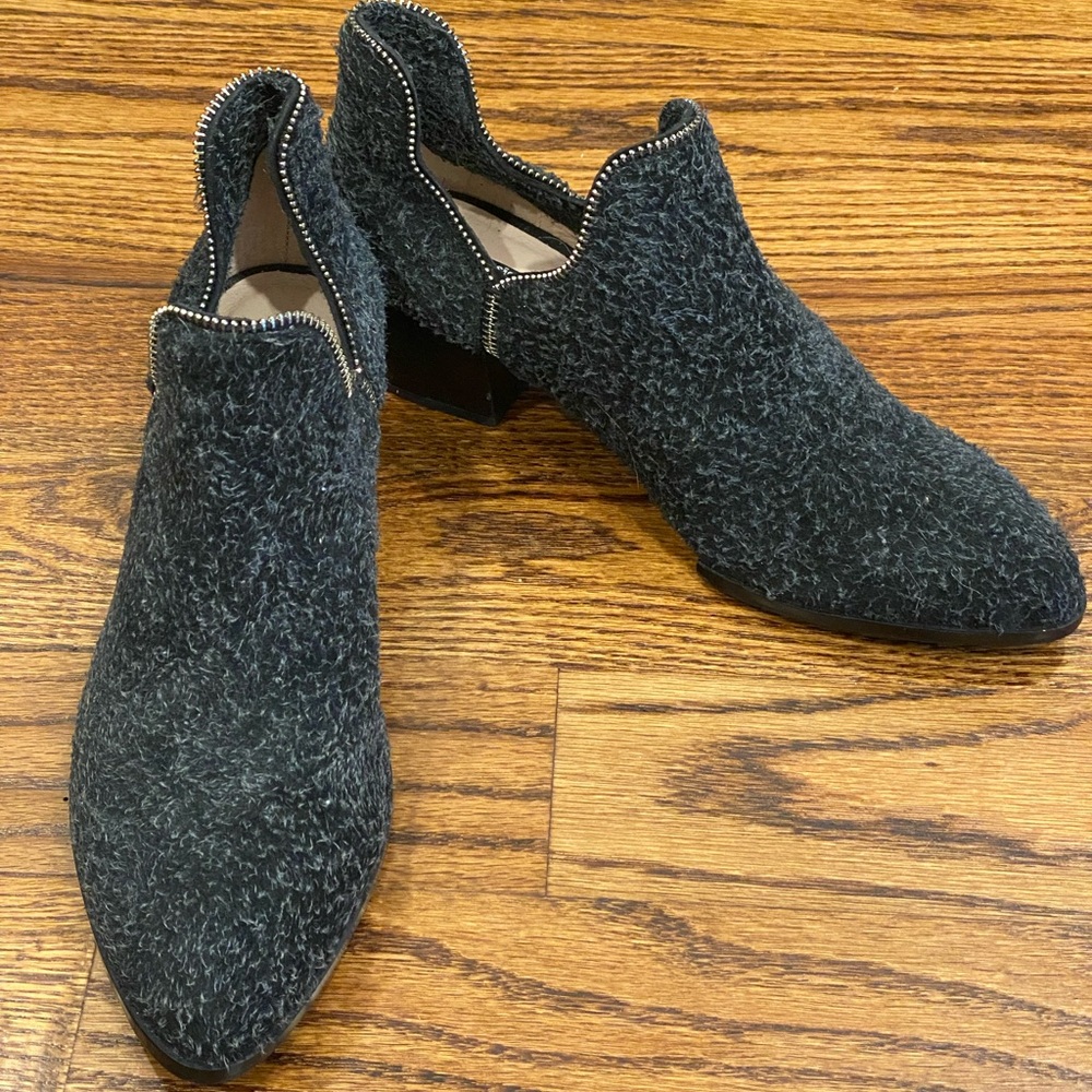 NWT never worn booties with zipper detail around ankles